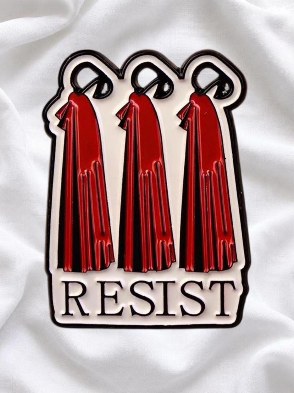 Resist enamel pin with Red Icon